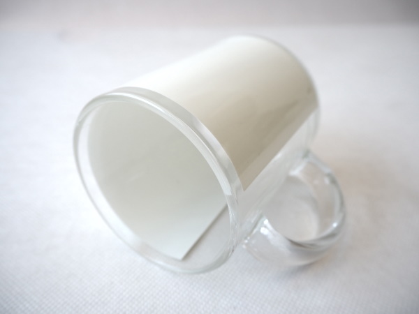 Transparent glass mug with white field for sublimation